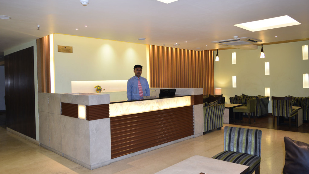 The reception desk at Hotel Le Port